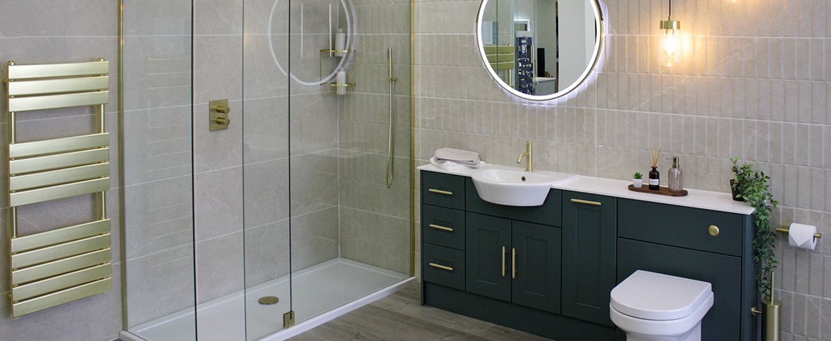 Small bathroom with dark green furniture and gold accents