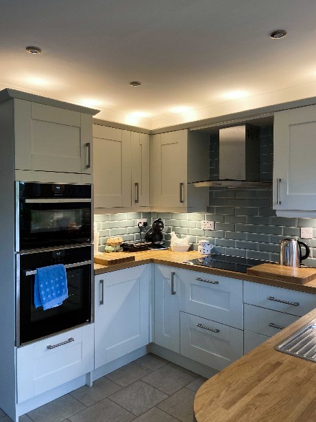 Double-NEFF-ovens-and-appliances-in-well-lit-shaker-kitchen-in-Spalding