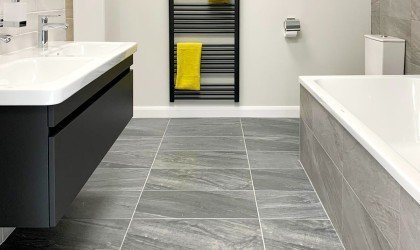 Simple contemporary bathroom with grey tiles